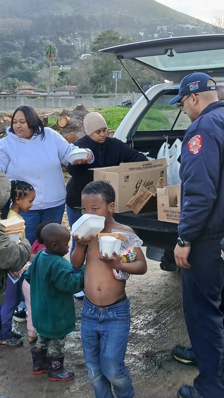 A handover moment during a Bayside community charity drive