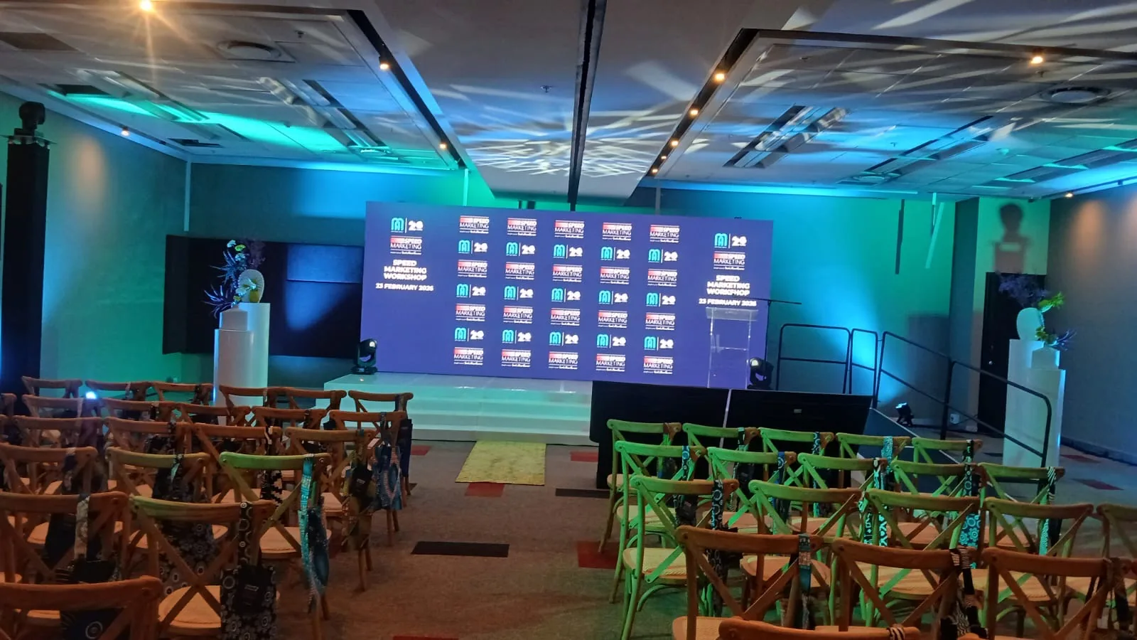 Speed Marketing Workshop room fully set at Sandton Convention Centre with branded LED wall and teal uplighting