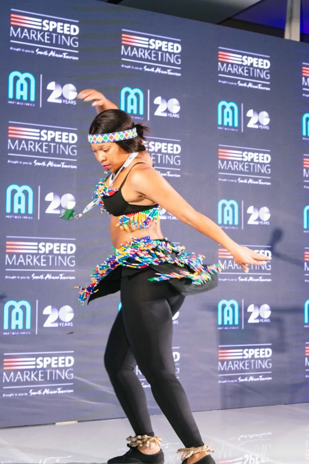 Traditional South African dancer performing at the Speed Marketing media wall
